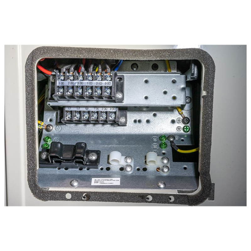 Close up of electrical panel of ACiQ 30000 BTU mini split system showing terminal wiring and connectors