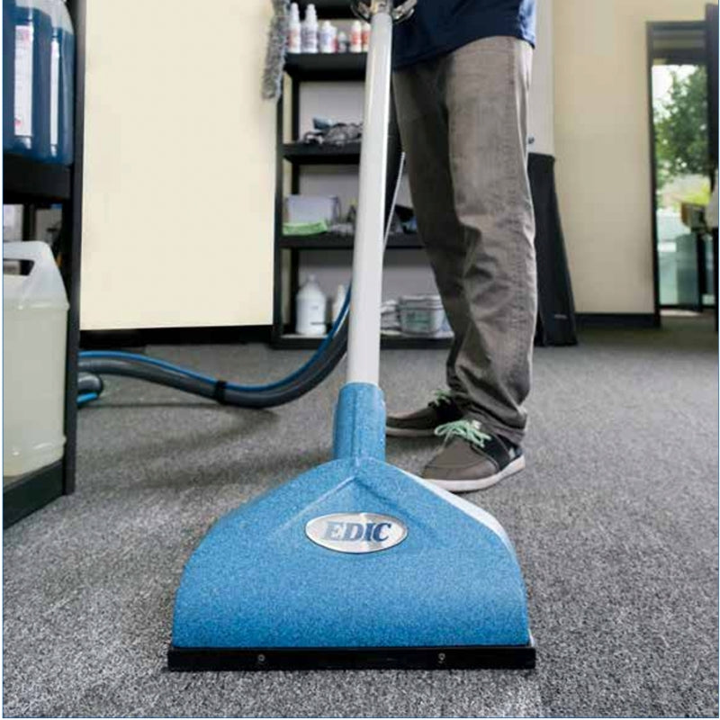 Man Using the EDIC USA TR19501FSA Triton Wand on Carpet