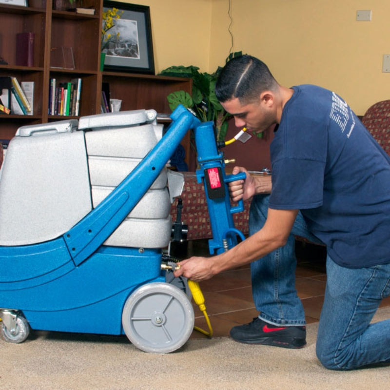 Man installing the Heat N Run external heater to an edic carpet extractor