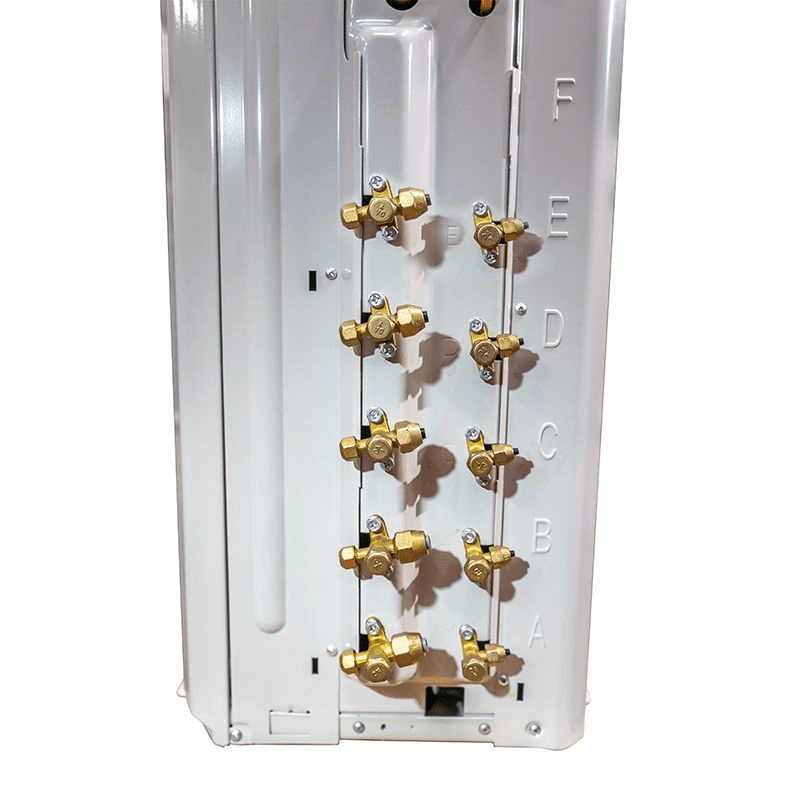 A close-up view of the brass refrigerant line connections, or service valves, on a multi-zone air conditioner condenser unit, labeled with the letters A, B, C, and D