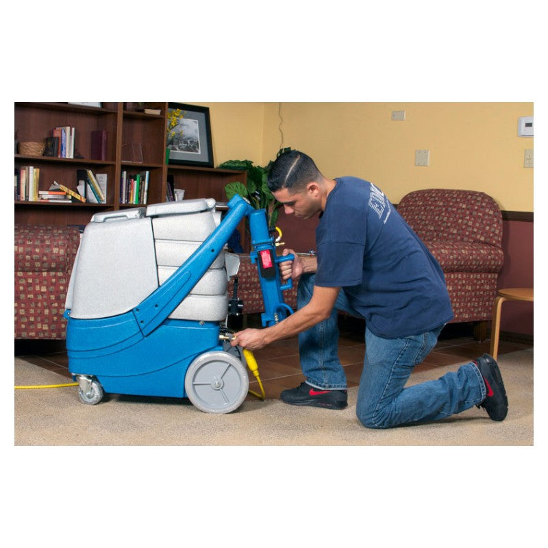 EDIC Galaxy 2000SX-HR 12 Gallon Box Carpet Extractor - 100 PSI with Man Inserting the External Heater for Heated Cleaning