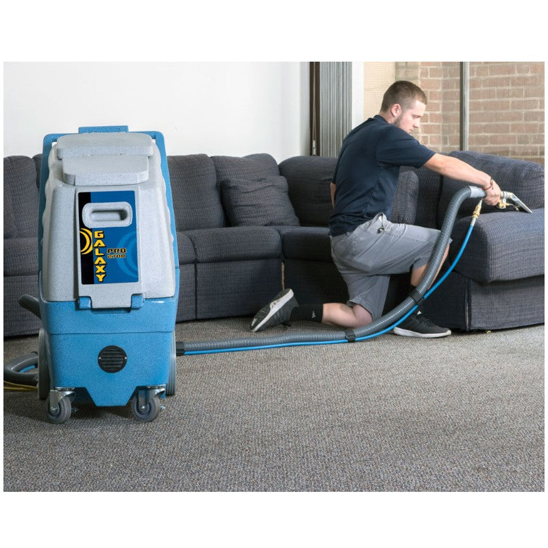 Man Cleaning the Upholstery Using EDIC Galaxy Pro 2700IX-HR Carpet Extractor for Spotless Results